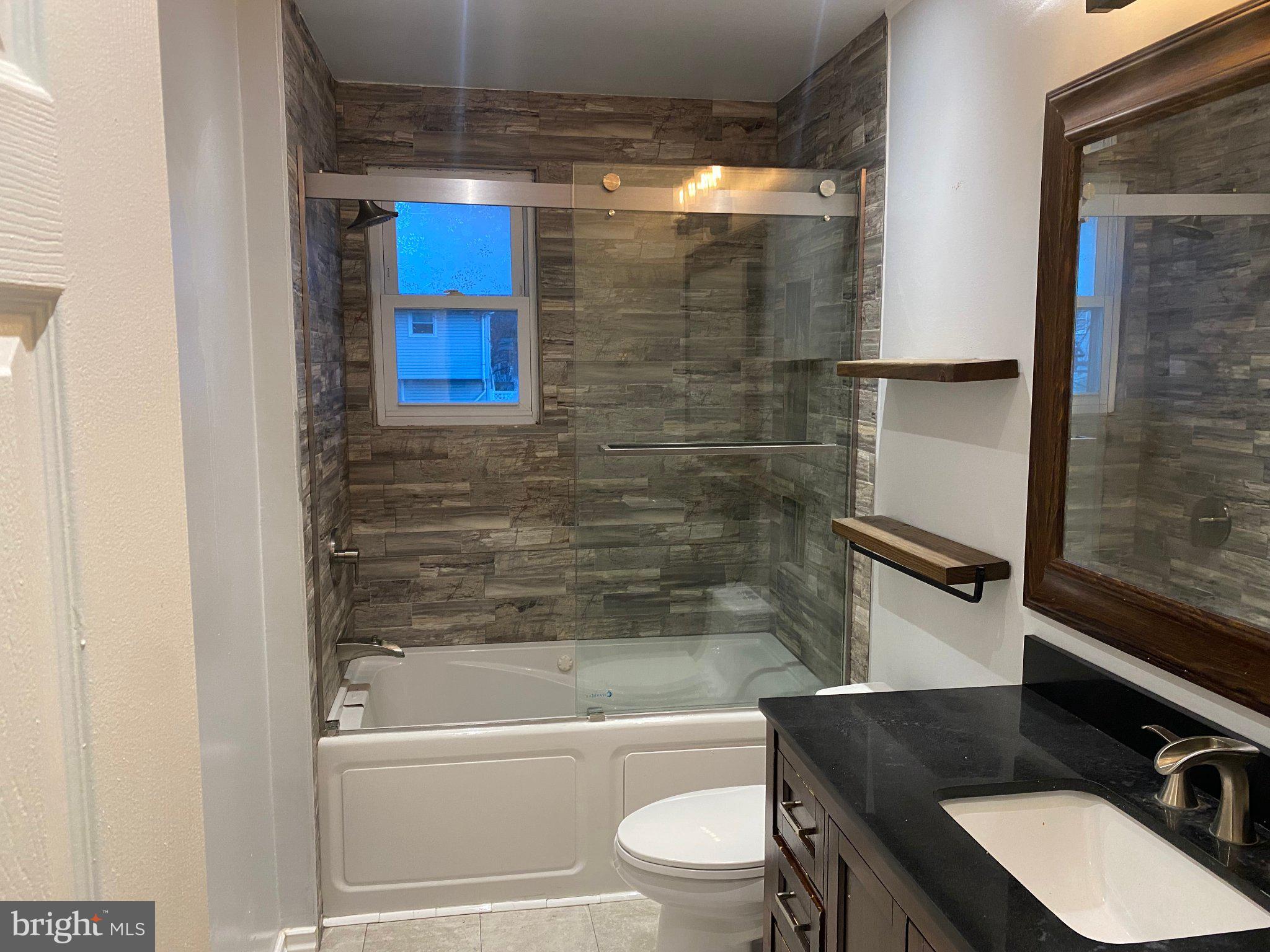 106 Parkview Road Stratford, NJ 08084 - Photo 10 of 27 a bathroom with a sink and a mirror