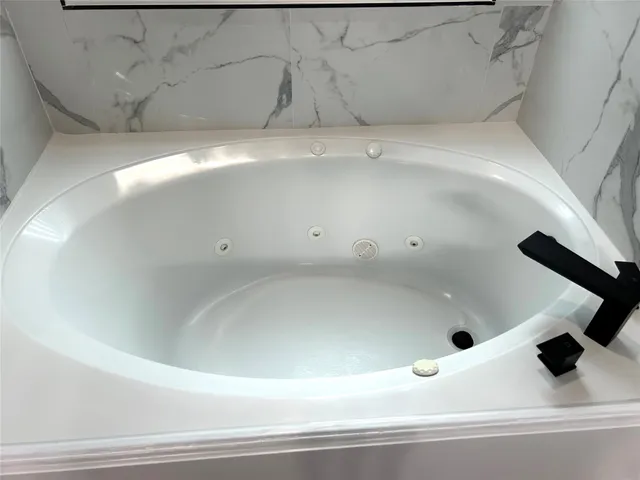 a view of a bathtub in a bathroom
