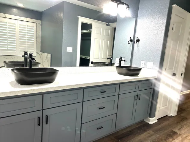 a bathroom with a sink and a mirror