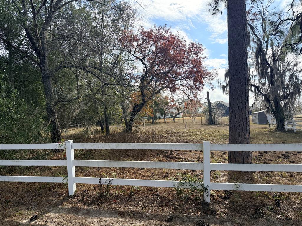 Oakcrest Circle Brooksville, FL 34604 - Photo 2 of 8 a view of backyard with wooden fence