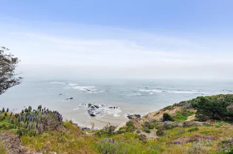 an aerial view of beach and ocean