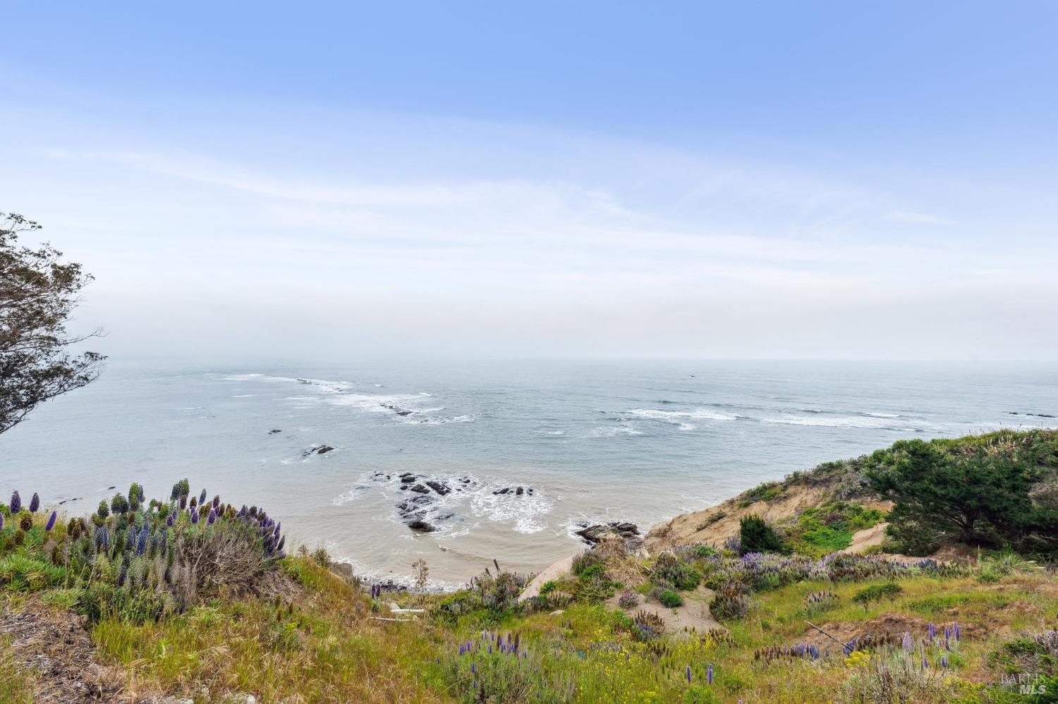 an aerial view of beach and ocean