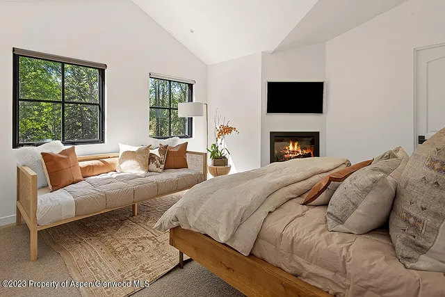 a view of a living room with furniture and flowers