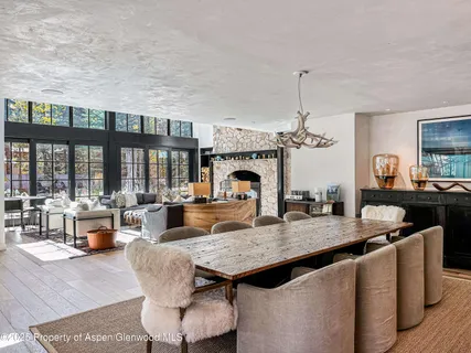 a large kitchen with a table and chairs