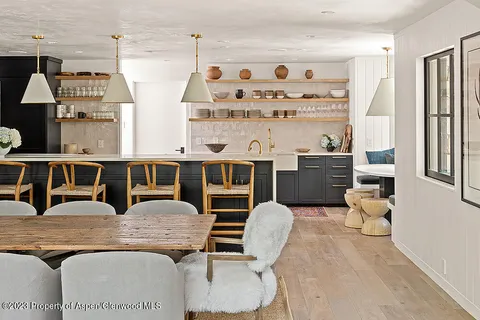 a bathroom with a sink vanity and mirror