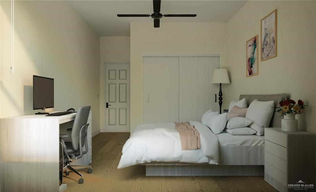 2909 Santa Amanda, Unit 1 Weslaco, TX 78596 - Photo 7 of 10 a bedroom with a bed and flat screen tv