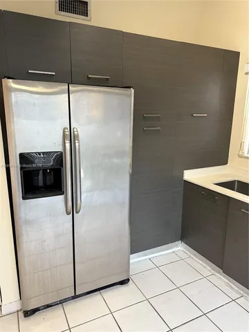 a kitchen with a refrigerator