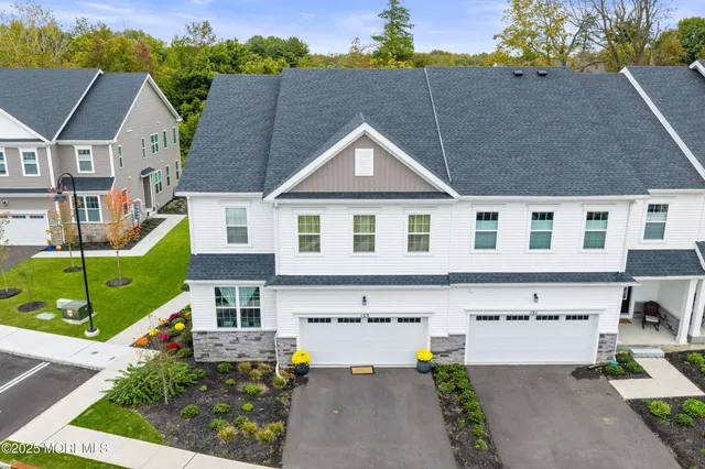 an aerial view of a house with a swimming pool