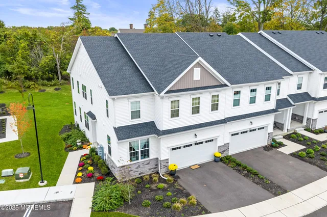 a aerial view of a house with a yard