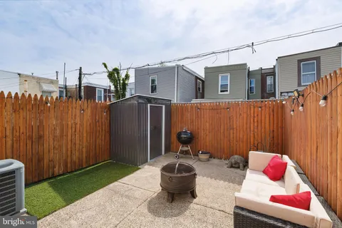 a backyard of a house with seating space