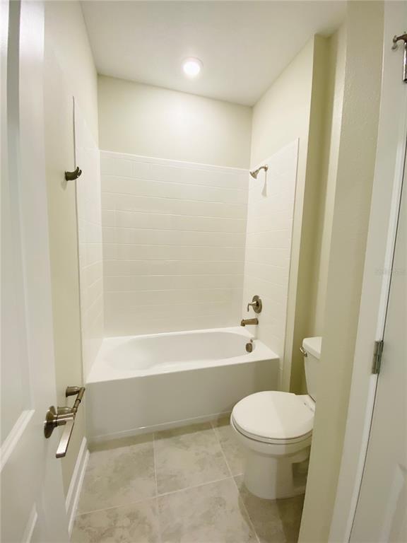 2768 Norway Maple Court Ocoee, FL 34761 - Photo 11 of 35 a bathroom with a toilet and a bathtub