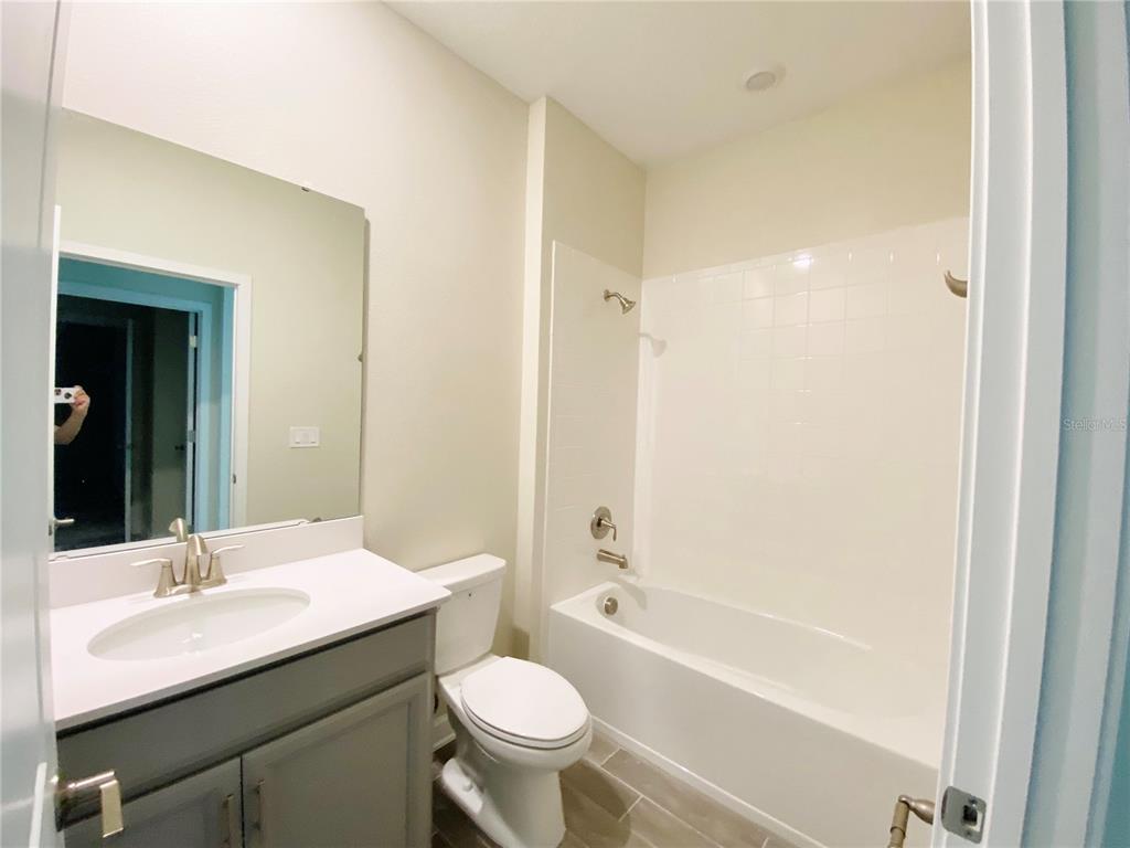 2768 Norway Maple Court Ocoee, FL 34761 - Photo 14 of 35 a bathroom with a sink a toilet and shower