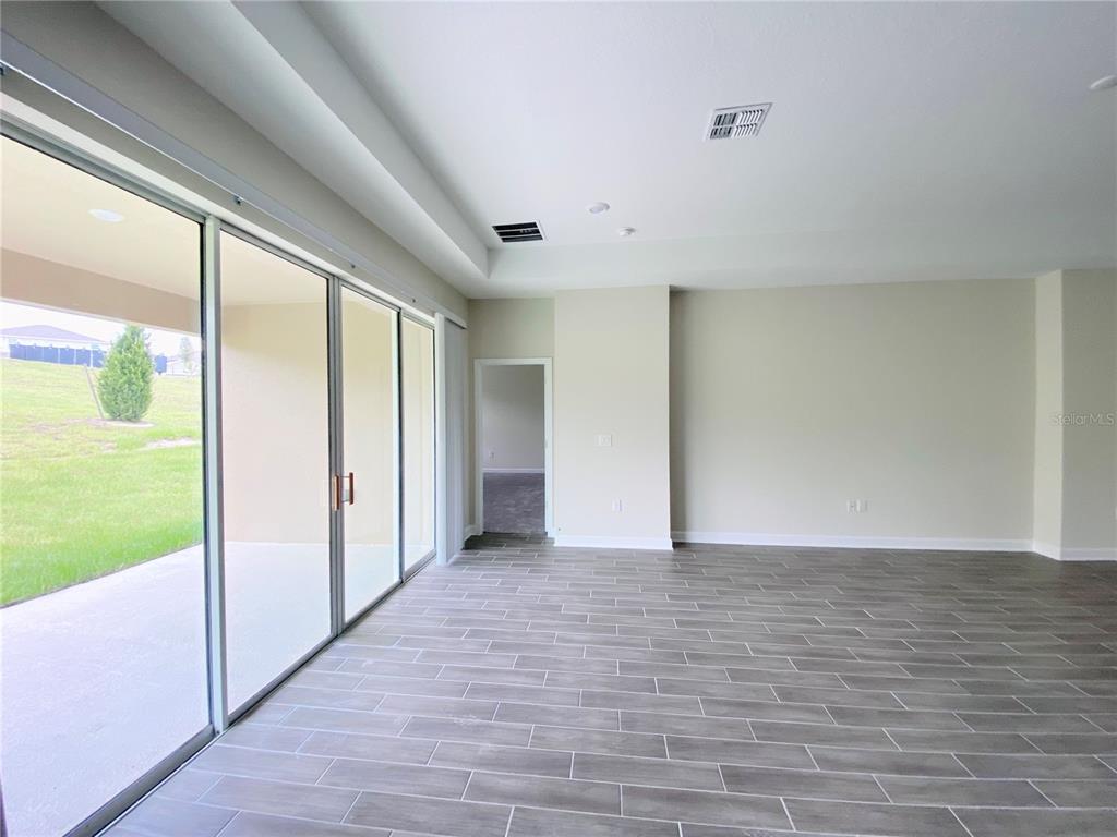 2768 Norway Maple Court Ocoee, FL 34761 - Photo 8 of 35 a view of empty room with wooden floor