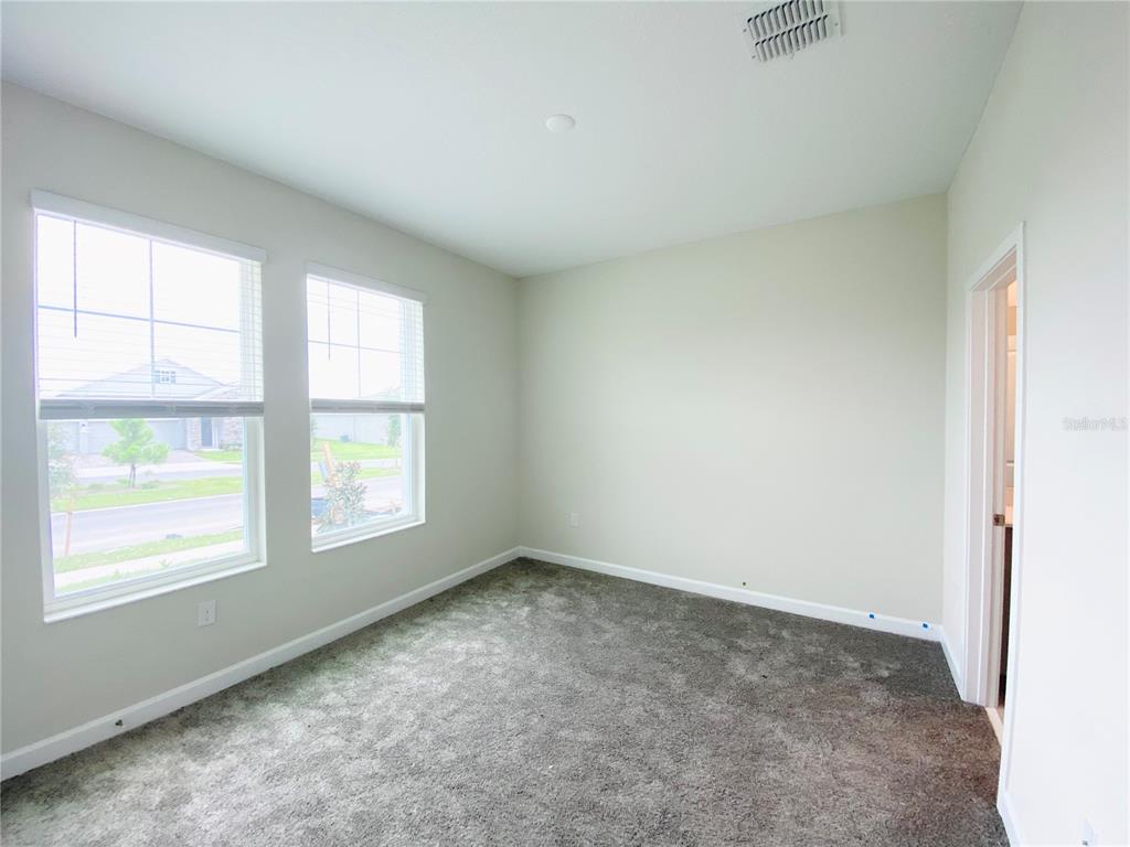 2768 Norway Maple Court Ocoee, FL 34761 - Photo 9 of 35 an empty room with windows