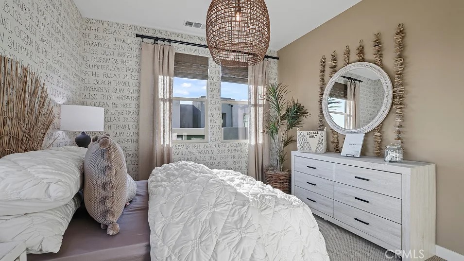 1135 Walnut Terrace Montebello, CA 90640 - Photo 20 of 30 a bedroom with a bed and a mirror on dresser