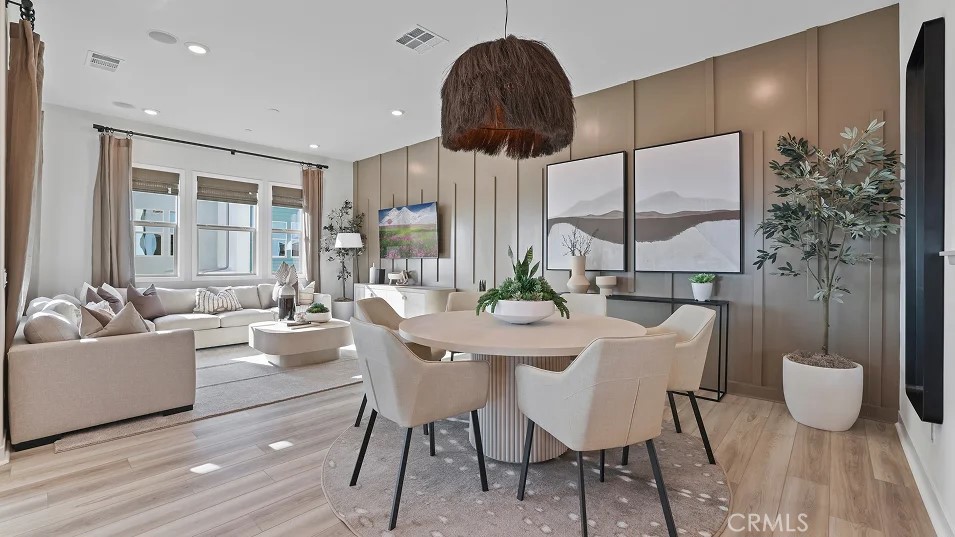 1135 Walnut Terrace Montebello, CA 90640 - Photo 5 of 30 a view of a dining room with furniture a chandelier and wooden floor