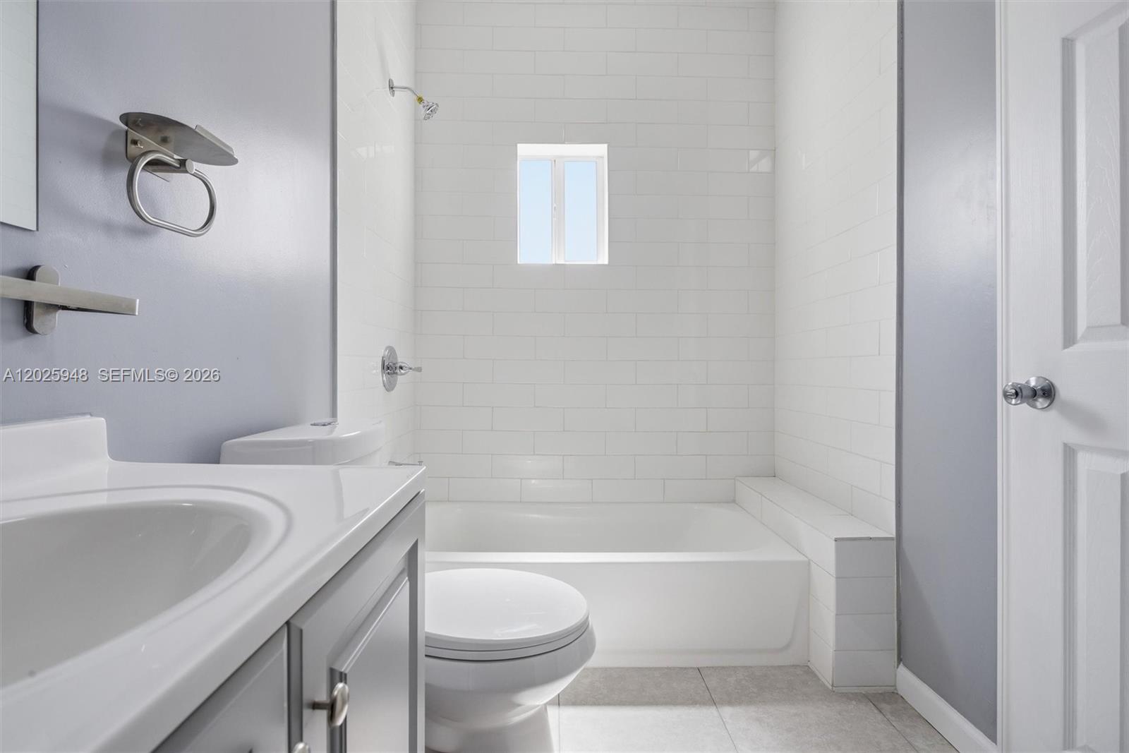 1745 Southwest 17th Street, Unit 2 Miami, FL 33145 - Photo 23 of 32 a bathroom with a sink a toilet and a bathtub