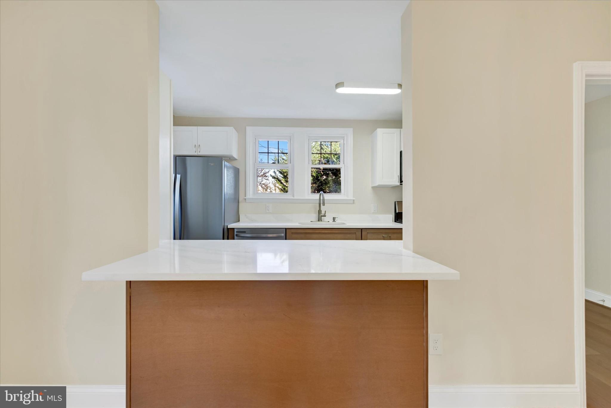 19 Dunmore Road Catonsville, MD 21228 - Photo 14 of 50 a view of a kitchen with granite countertop cabinets and a refrigerator