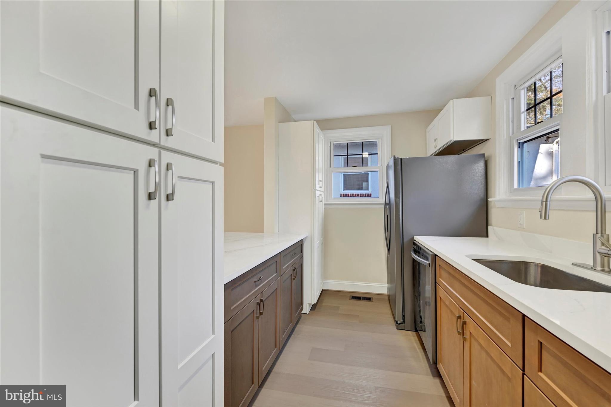 19 Dunmore Road Catonsville, MD 21228 - Photo 17 of 50 a kitchen with stainless steel appliances granite countertop a refrigerator and a sink