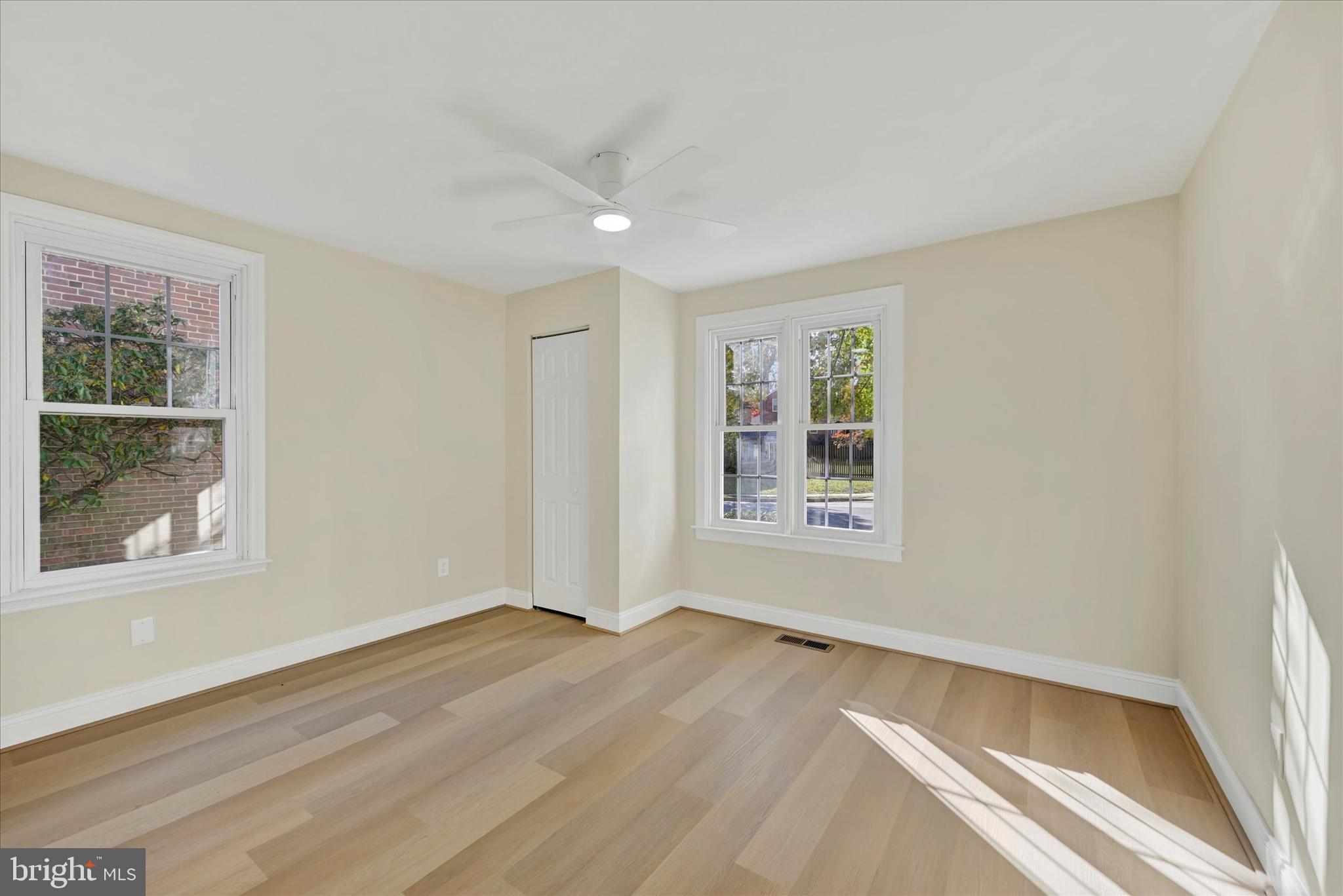 19 Dunmore Road Catonsville, MD 21228 - Photo 19 of 50 an empty room with wooden floor and windows