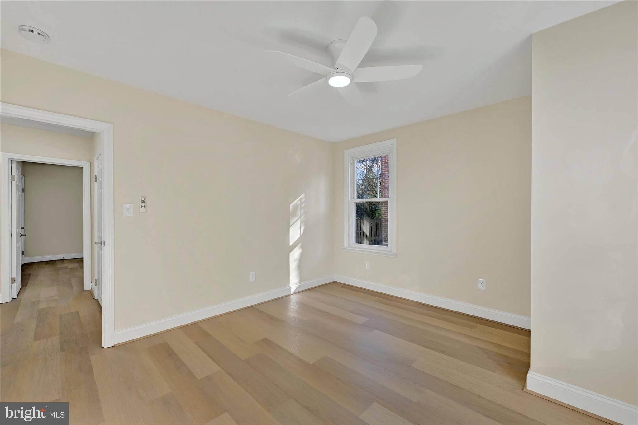 19 Dunmore Road Catonsville, MD 21228 - Photo 21 of 50 an empty room with wooden floor and windows