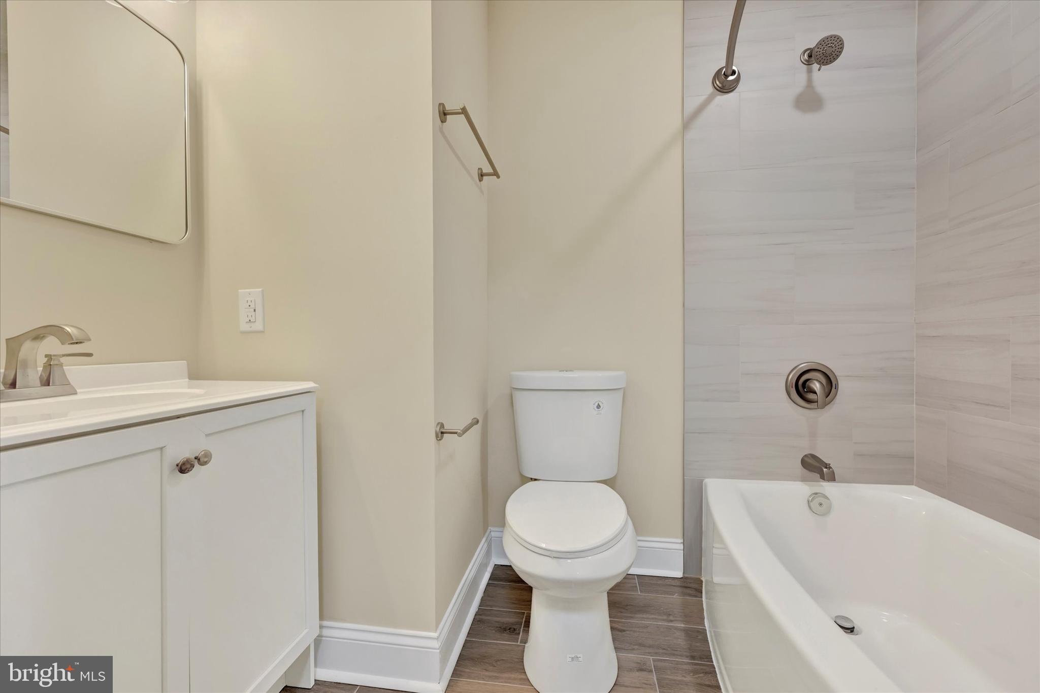 19 Dunmore Road Catonsville, MD 21228 - Photo 23 of 50 a bathroom with a sink a toilet and shower