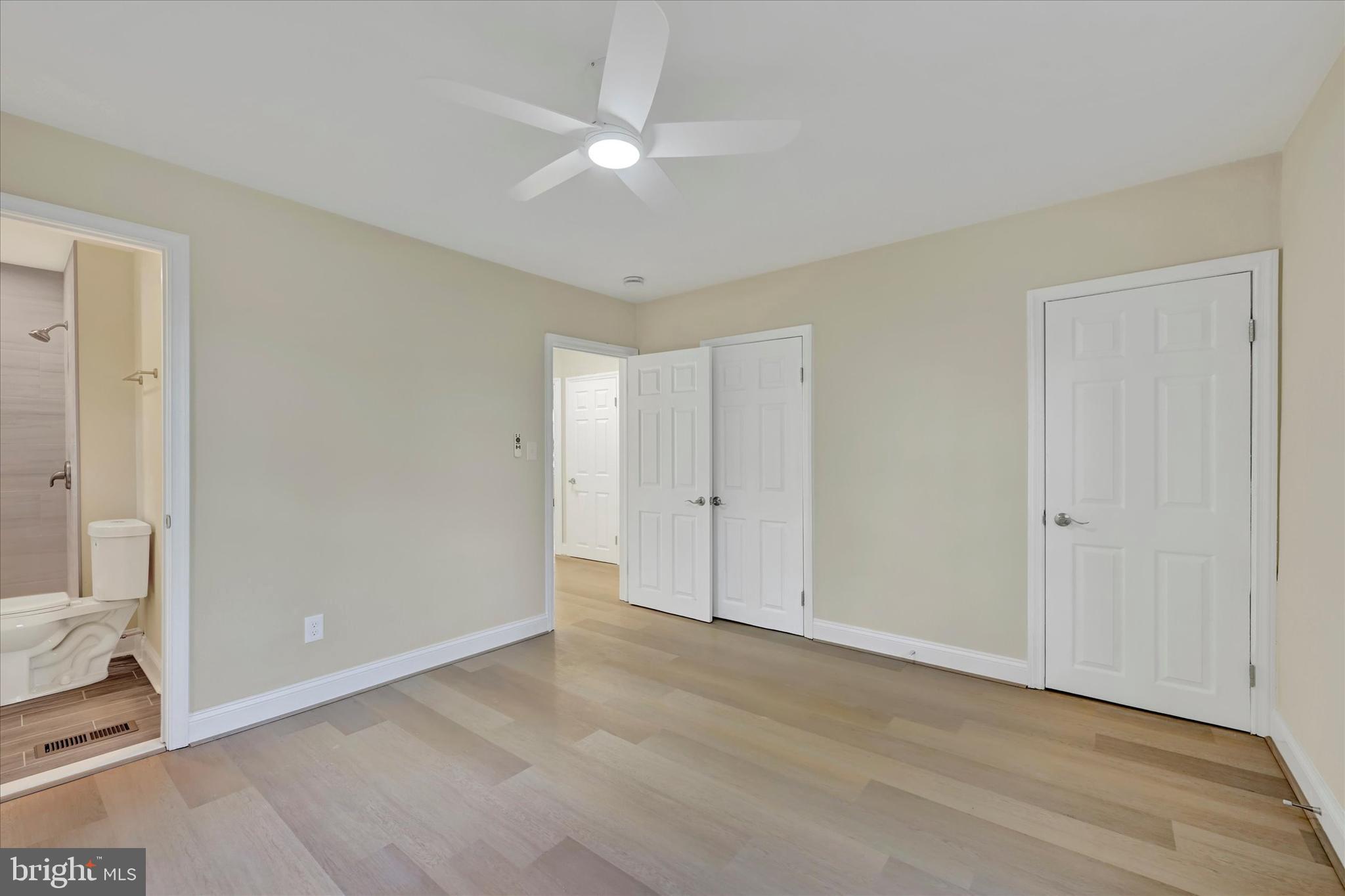 19 Dunmore Road Catonsville, MD 21228 - Photo 27 of 50 a view of an empty room with window and a ceiling fan