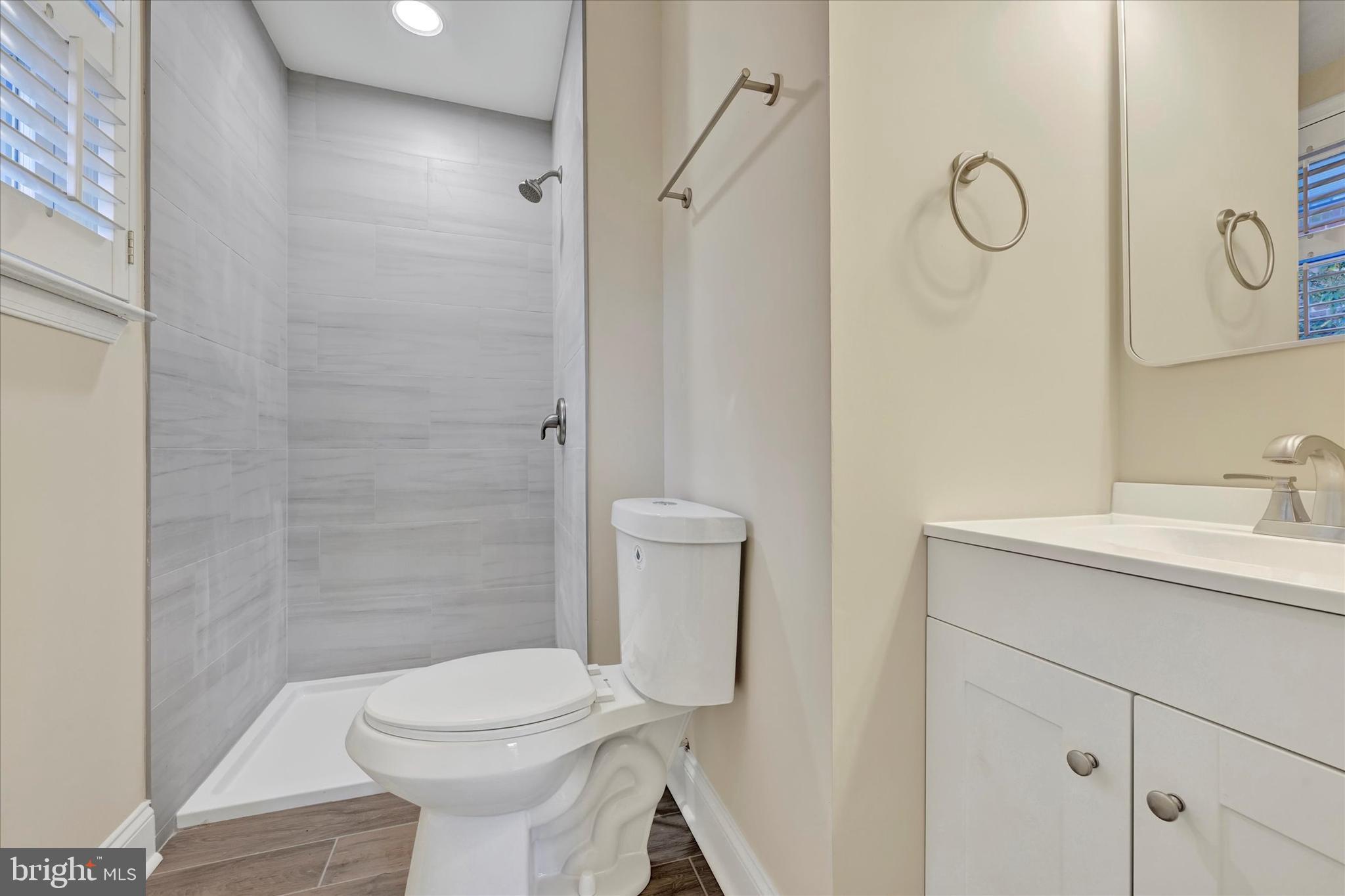 19 Dunmore Road Catonsville, MD 21228 - Photo 30 of 50 a bathroom with a toilet sink vanity and shower