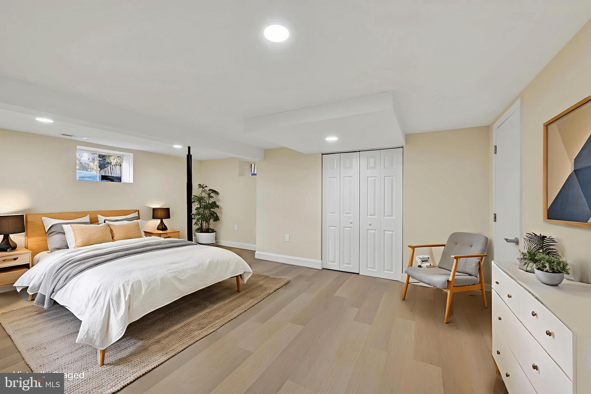 19 Dunmore Road Catonsville, MD 21228 - Photo 40 of 50 a bedroom with a bed and a chair in it