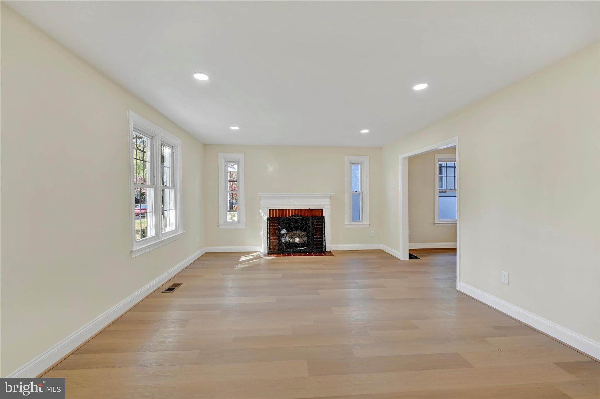 19 Dunmore Road Catonsville, MD 21228 - Photo 5 of 50 an empty room with windows and fireplace