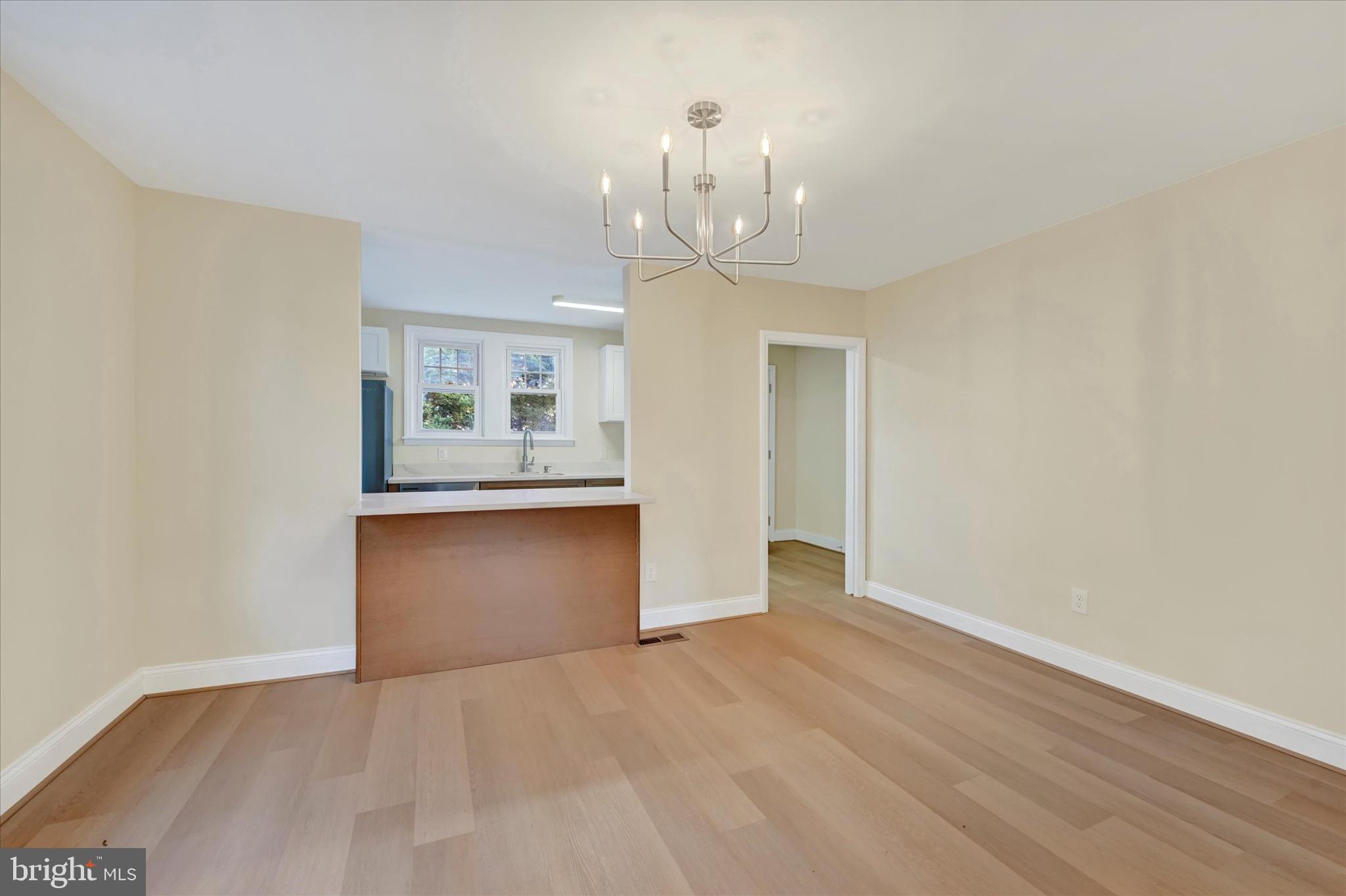 19 Dunmore Road Catonsville, MD 21228 - Photo 10 of 50 a view of an empty room with window and wooden floor