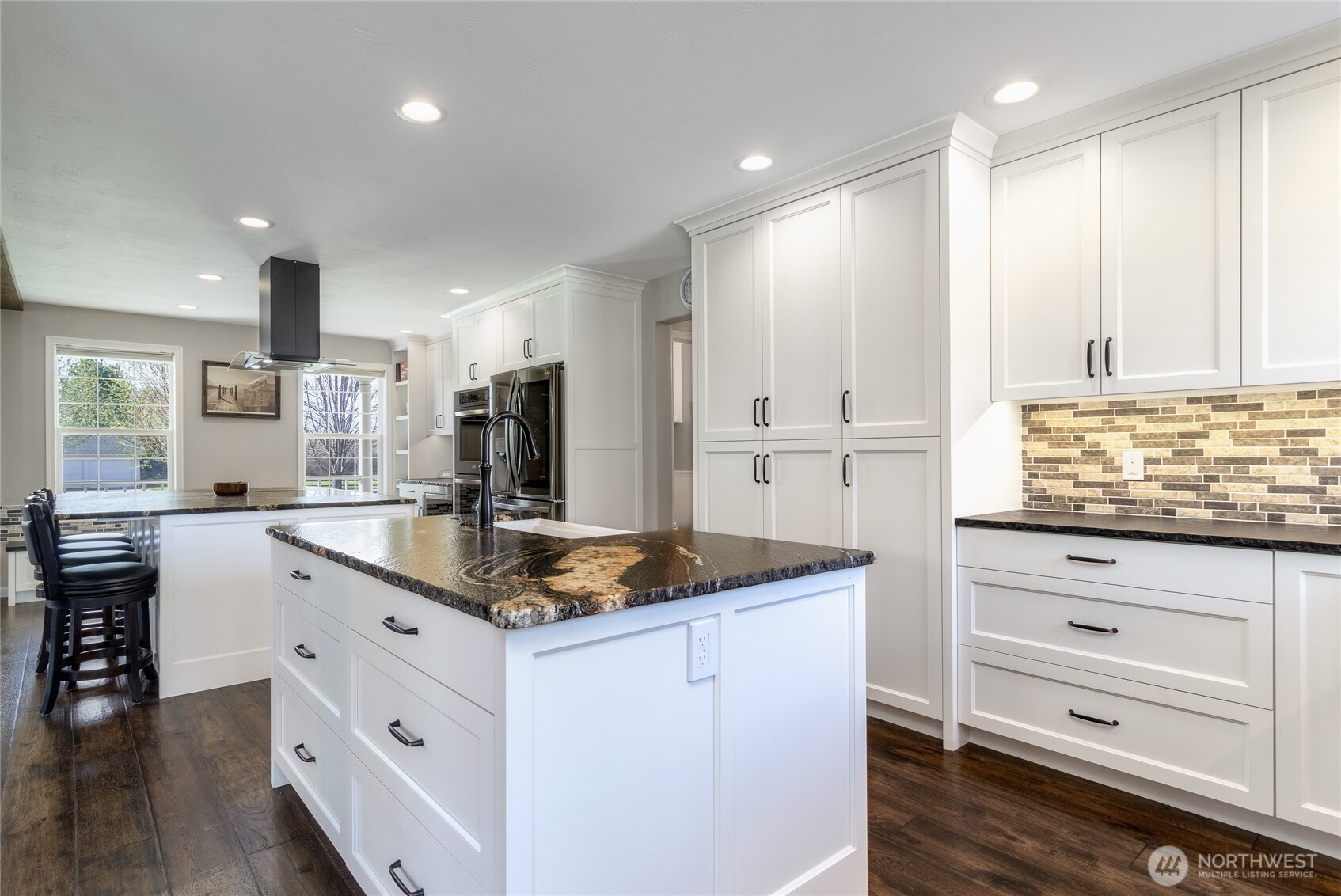 47 Austin Street Walla Walla, WA 99362 - Photo 11 of 40 a kitchen with granite countertop white cabinets and white appliances