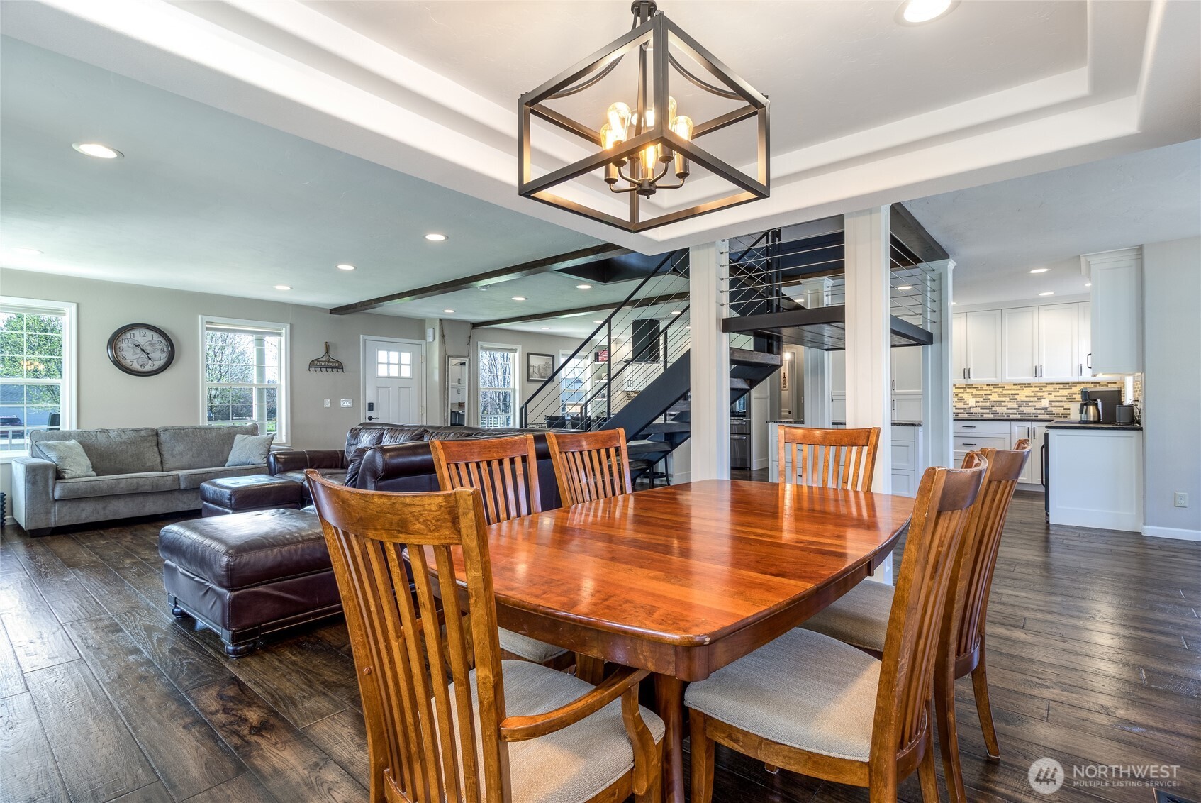 47 Austin Street Walla Walla, WA 99362 - Photo 13 of 40 a dining room with wooden floor a chandelier a wooden table and chairs