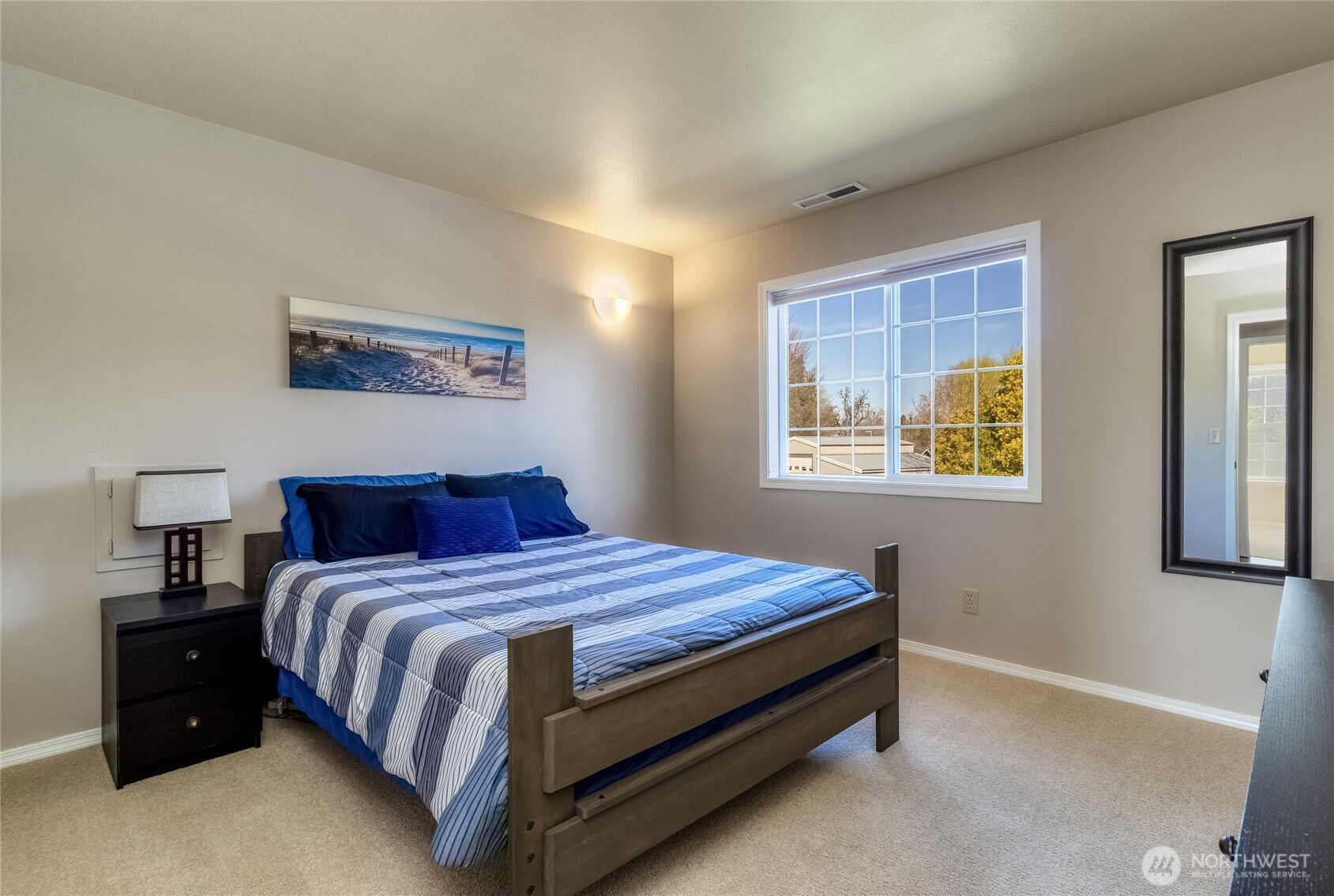 47 Austin Street Walla Walla, WA 99362 - Photo 23 of 40 a bedroom with a bed and wall painting