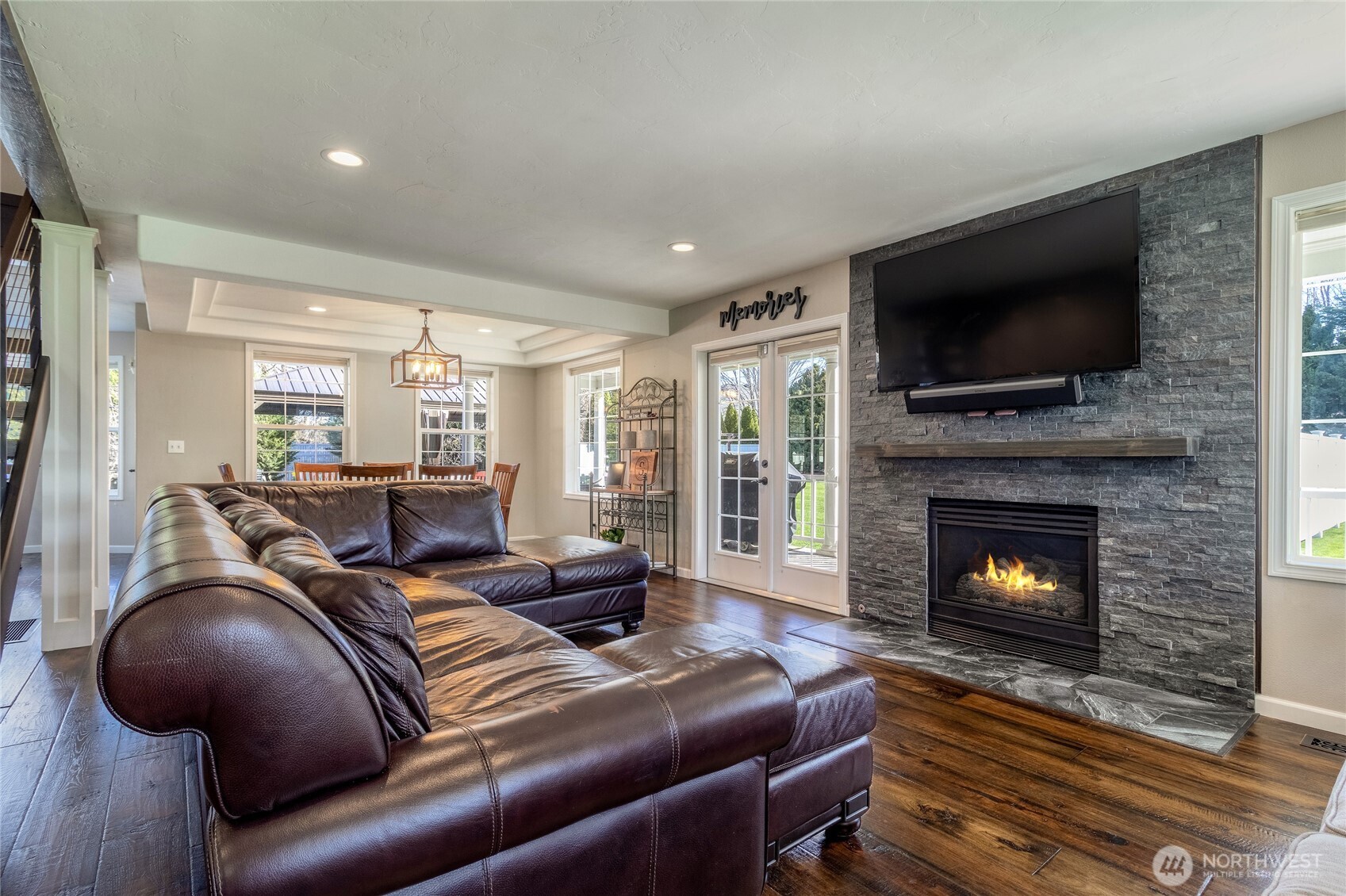47 Austin Street Walla Walla, WA 99362 - Photo 6 of 40 a living room with furniture a flat screen tv and a fireplace