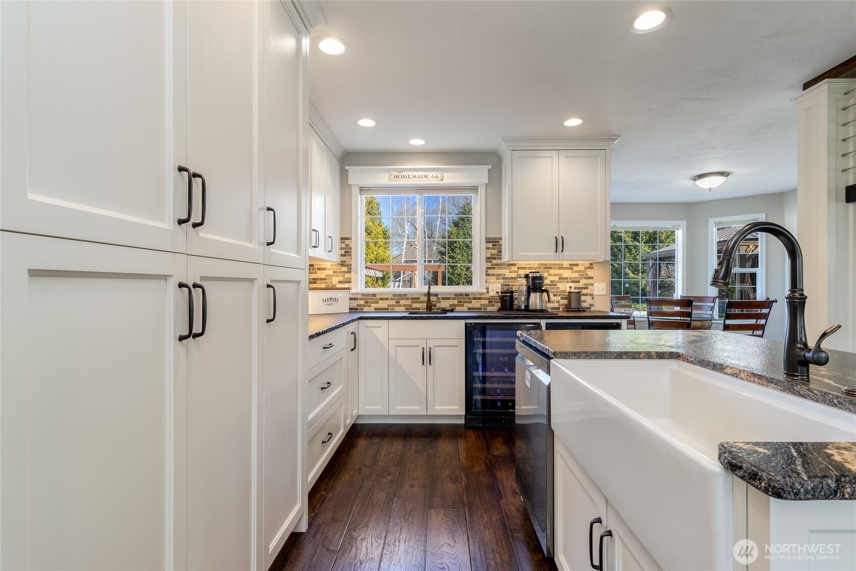 47 Austin Street Walla Walla, WA 99362 - Photo 10 of 40 a kitchen with stainless steel appliances granite countertop a sink cabinets and wooden floor