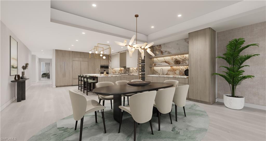 5000 Coconut Road, Unit 303 Bonita Springs, FL 34134 - Photo 19 of 27 a view of a a dining room with furniture window and wooden floor