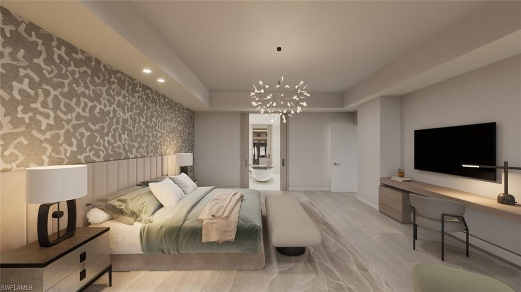 5000 Coconut Road, Unit 303 Bonita Springs, FL 34134 - Photo 20 of 27 a living room with furniture and a flat screen tv