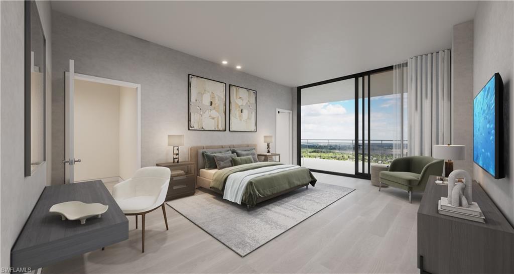 5000 Coconut Road, Unit 303 Bonita Springs, FL 34134 - Photo 23 of 27 a spacious bedroom with a bed and a large window