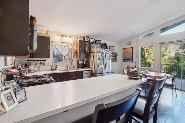 a view of a dining room with furniture and window