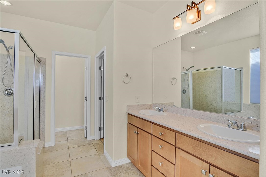 10419 Bush Mountain Avenue Las Vegas, NV 89166 - Photo 13 of 29 Primary Bathroom with tub and separate step-in shower.