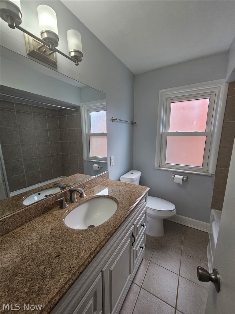 4237 Stonehaven Road South Euclid, OH 44121 - Photo 23 of 35 Vanity with granite-style countertop, undermount sink, and brushed nickel faucet