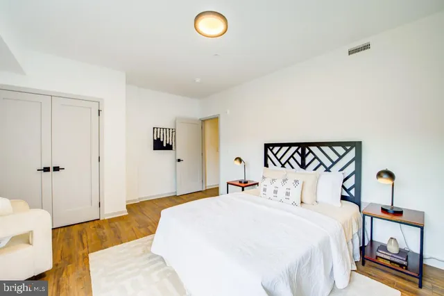 a bedroom with bed and a window