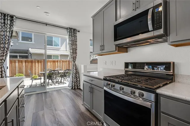 a kitchen with a stove and a microwave