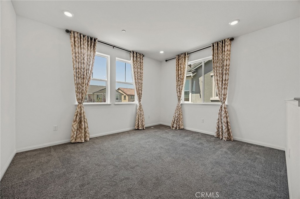 237 Goose Creek Avenue Brentwood, CA 94513 - Photo 16 of 49 an empty room with windows and closet