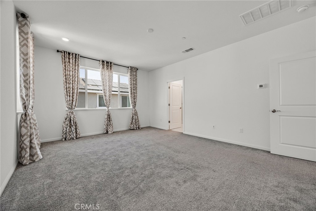 237 Goose Creek Avenue Brentwood, CA 94513 - Photo 19 of 49 an empty room with windows