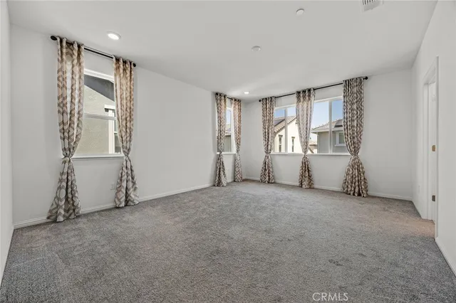 a view of empty room with windows