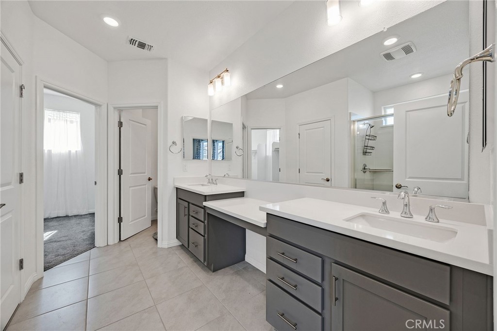237 Goose Creek Avenue Brentwood, CA 94513 - Photo 23 of 49 a spacious bathroom with a shower sink double and mirror