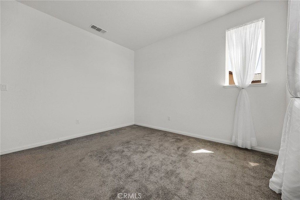237 Goose Creek Avenue Brentwood, CA 94513 - Photo 31 of 49 an empty room with windows
