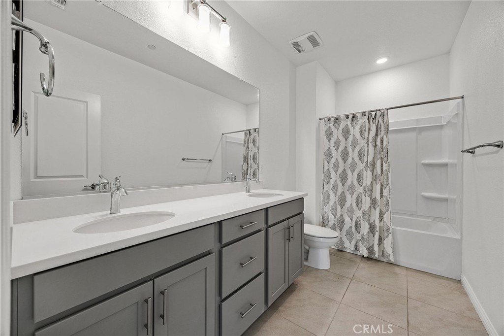 237 Goose Creek Avenue Brentwood, CA 94513 - Photo 32 of 49 a spacious bathroom with a double vanity sink toilet and a shower